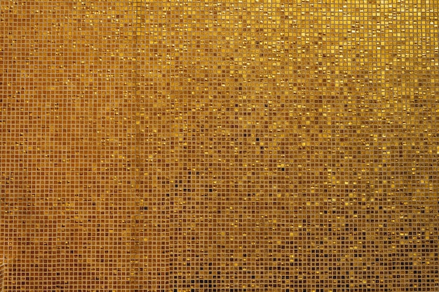 Textura de mosaico de oro pequeño Pequeños mosaicos de oro dispuestos para encajar en el fondo Fondo de mosaico de vidrios de mosaico dorado