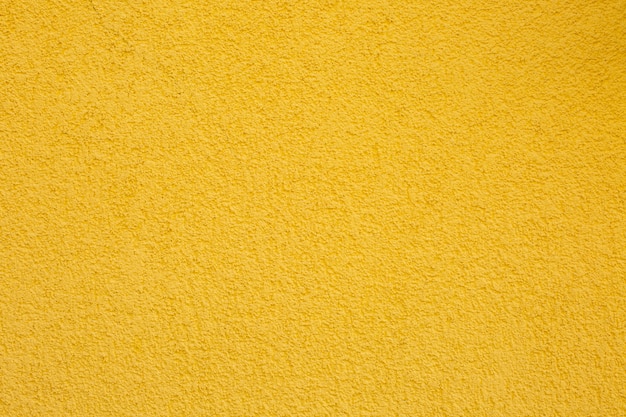 Textura de muro de hormigón amarillo