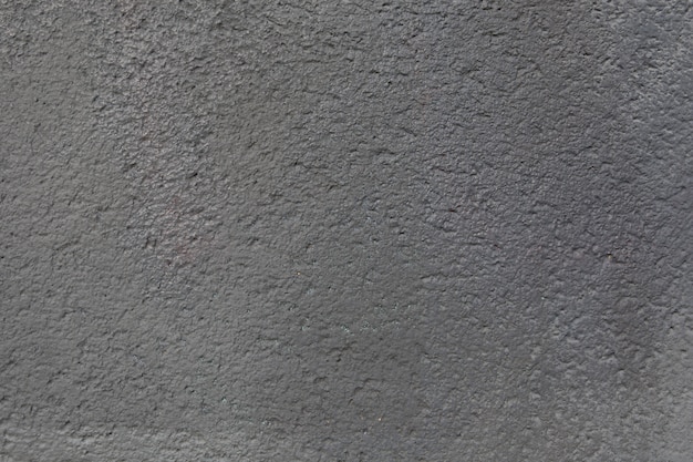 Textura de muro de hormigón con baches grises para diseñador