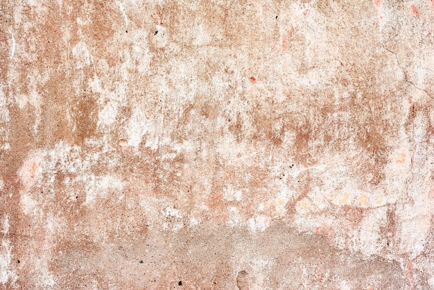 Foto textura de un muro de hormigón con grietas y arañazos de fondo