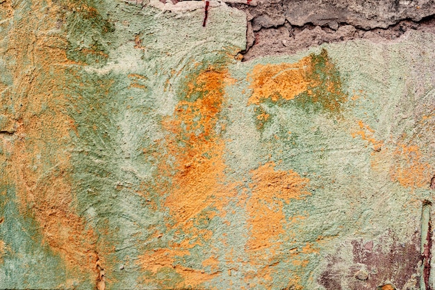 Foto textura de un muro de hormigón con grietas y arañazos