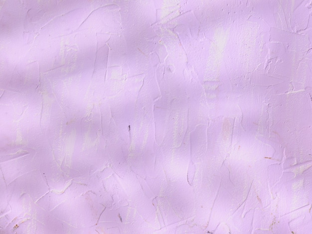 Textura de muro de hormigón morado con sombras