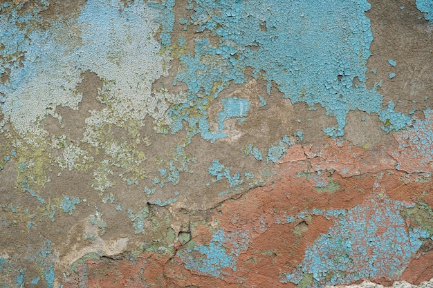 Textura de un muro de hormigón con pintura desconchada