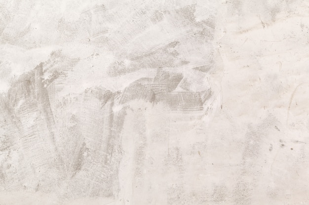 Textura de muro de hormigón de primer plano con yeso y pintura blanca