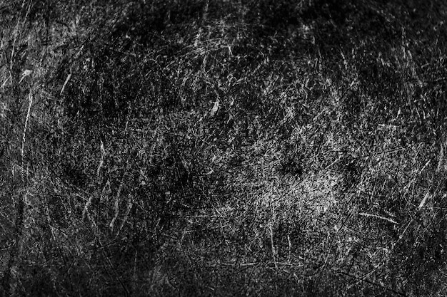 Textura negra grunge La textura de los arañazos en el metal La textura raya el fondo monocromo Fondo duro con textura áspera La superficie está dañada