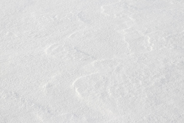 Textura de nieve blanca ligera, superficie de nieve dura