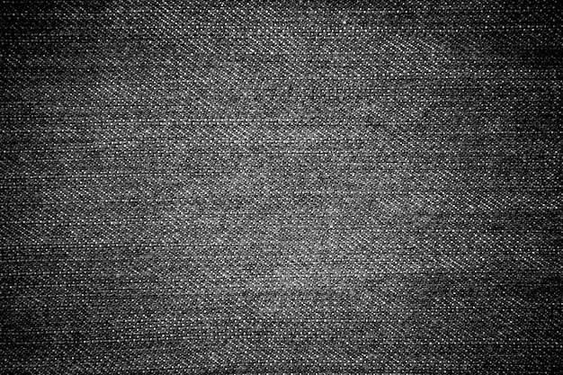 Textura de los pantalones vaqueros del dril de algodón negro para el fondo