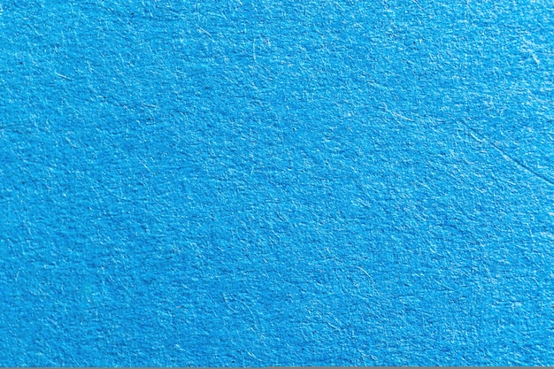 Textura de papel alta detallada azul cielo, primer plano de fondo de superficie de papel granulado