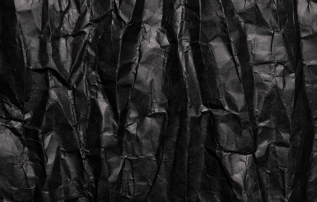 Textura de papel arrugado negro, fondo grunge