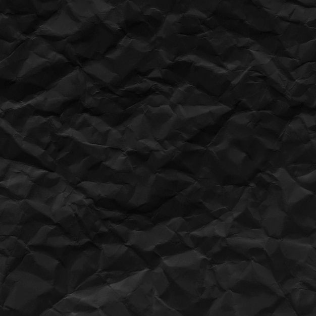 Foto textura de papel arrugado negro para el fondo.