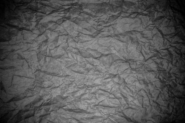 Foto textura de papel arrugado negro.