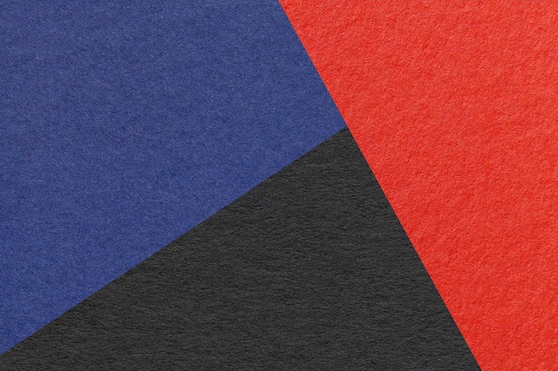 Textura de papel artesanal negro rojo y azul marino sombra color fondo macro Vintage cartón abstracto