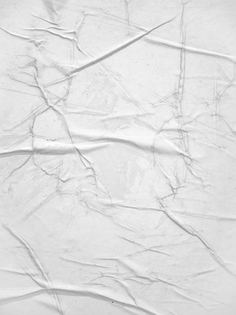 Foto textura de papel blanco en blanco pegado en la pared