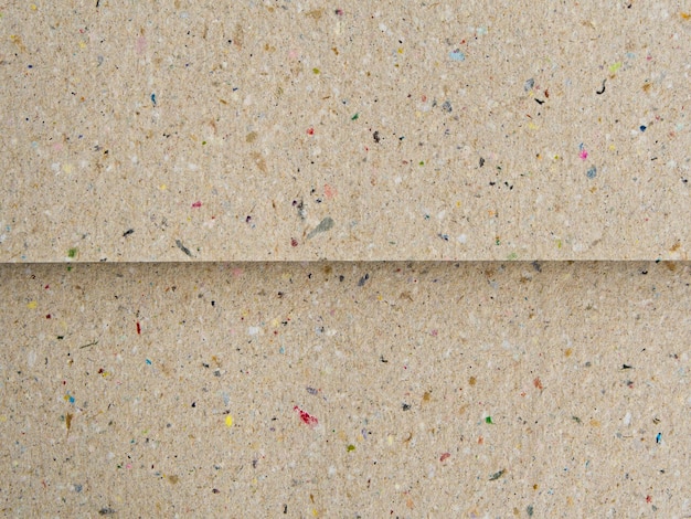 La textura del papel de cartón reciclado de fondo de color marrón