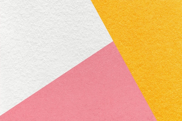 Textura de papel de color de tono amarillo y rosa blanco artesanal estructura macro de fondo de cartón abstracto vintage