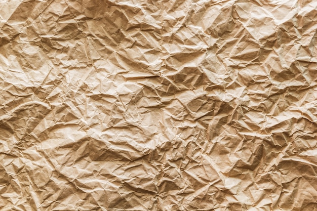 Foto textura de papel marrón arrugado