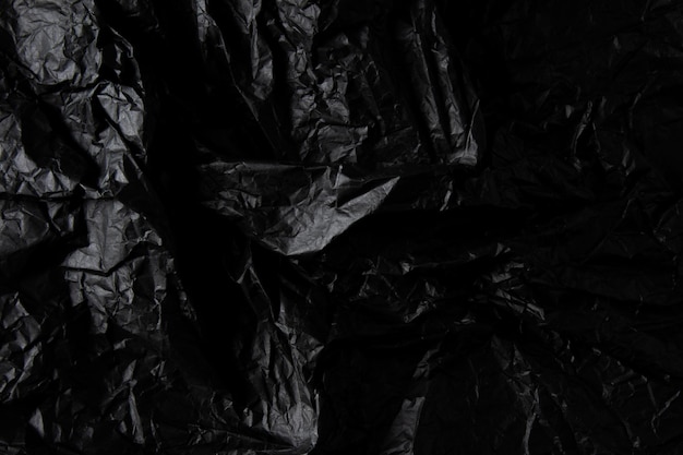 Textura de papel negro arrugado.