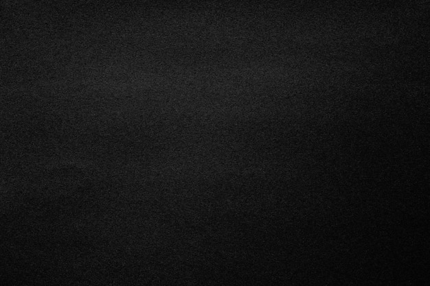 Textura de papel negro con macro de primer plano de grano