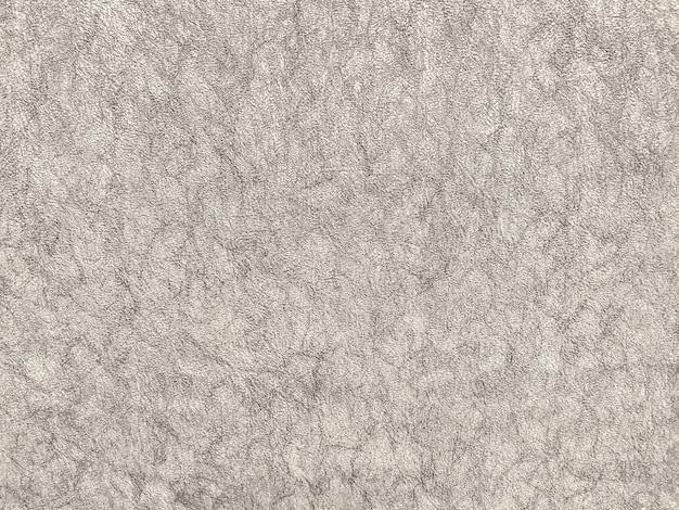 Textura de papel tapiz beige con un patrón