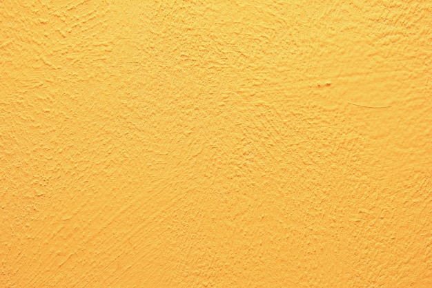 Textura de pared amarilla. Fondo de pared amarillo cálido brillante.