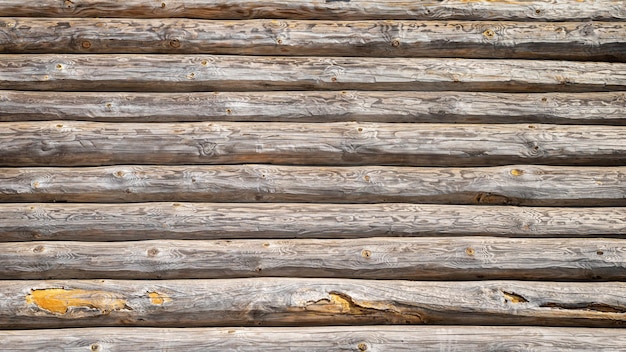 Textura de pared de un antiguo fondo de casa de troncos de madera