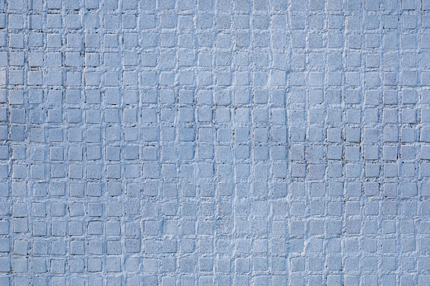 Textura de pared azul grisáceo con pequeños azulejos