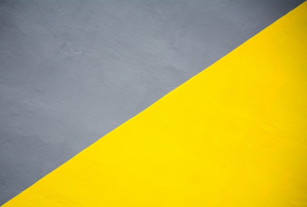 Textura de pared de cemento amarillo y gris