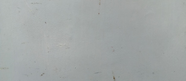 La textura de la pared de cemento gris el fondo de la muralla de cimiento gris tomada de un primer plano a