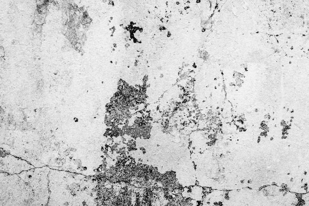 Textura, pared, fondo de hormigón. Fragmento de pared con arañazos y grietas.