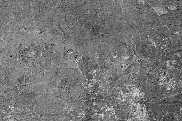 Textura, pared, fondo de hormigón. Fragmento de pared con rasguños y grietas.