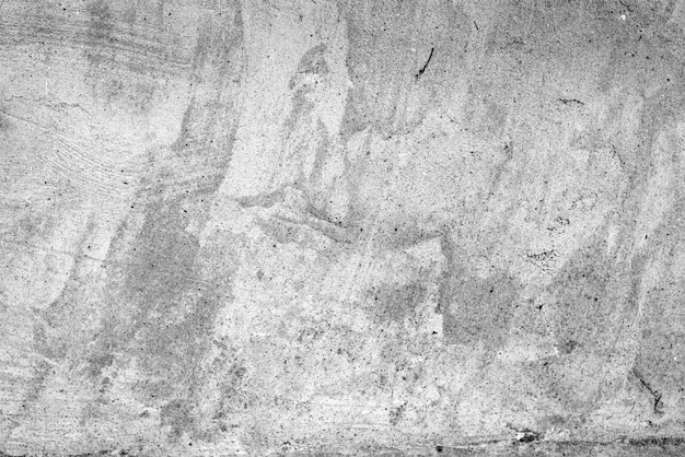 Textura, pared, fondo de hormigón. Fragmento de pared con rasguños y grietas.