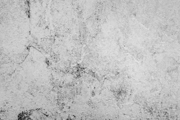 Textura, pared, fondo de hormigón. Fragmento de pared con rasguños y grietas.