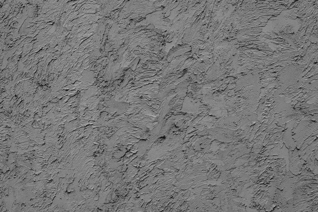 Textura, pared, fondo de hormigón. Fragmento de pared con rasguños y grietas.