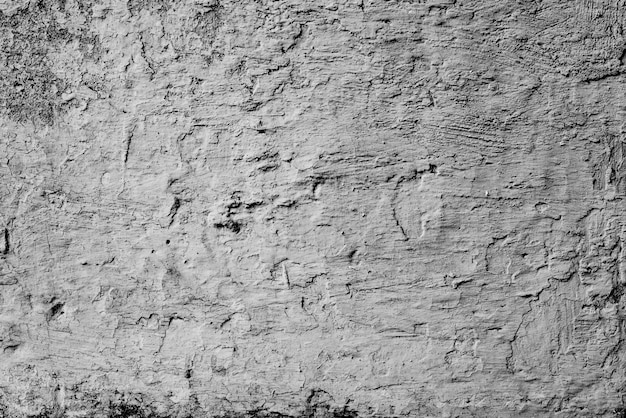 Textura, pared, fondo de hormigón. Fragmento de pared con rasguños y grietas.