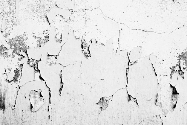 Textura, pared, hormigón. Fragmento de pared con arañazos y grietas.