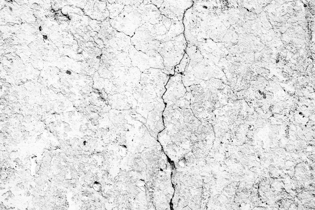 Textura de una pared de hormigón con grietas y arañazos que se pueden utilizar como fondo