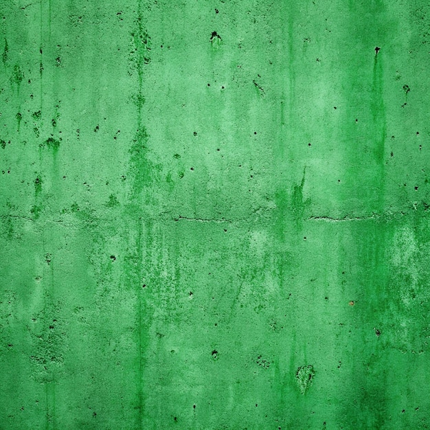 Textura de la pared de hormigón pintada más o menos de verde