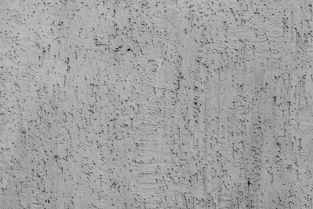 Foto textura, pared, hormigón, se puede utilizar como fondo. fragmento de pared con arañazos y grietas.