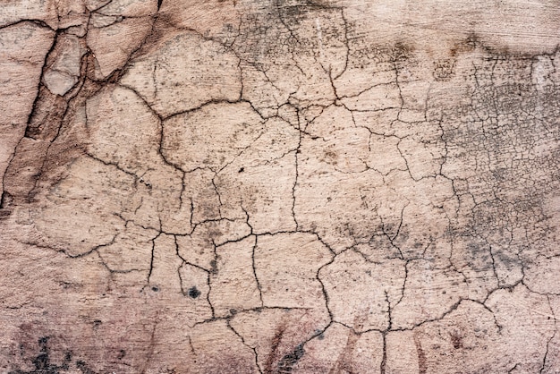 Textura, pared, hormigón, se puede utilizar como fondo. Fragmento de pared con rasguños y grietas.