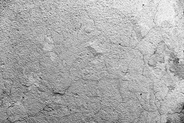 Textura, pared, hormigón, se puede utilizar como fondo. Fragmento de pared con rasguños y grietas.