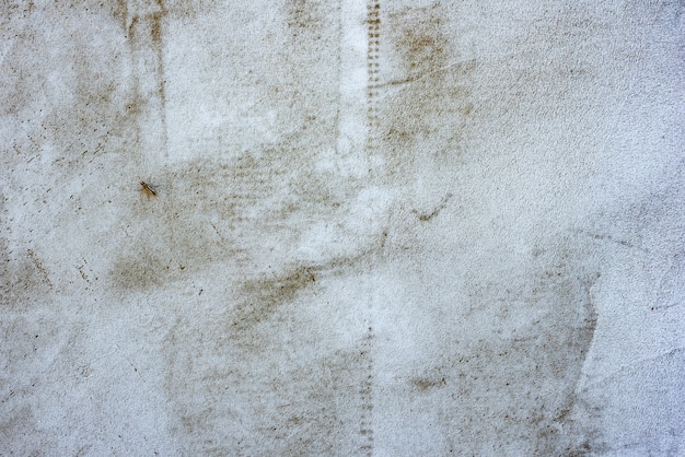 Textura, pared, hormigón, se puede utilizar como fondo. Fragmento de pared con rasguños y grietas.