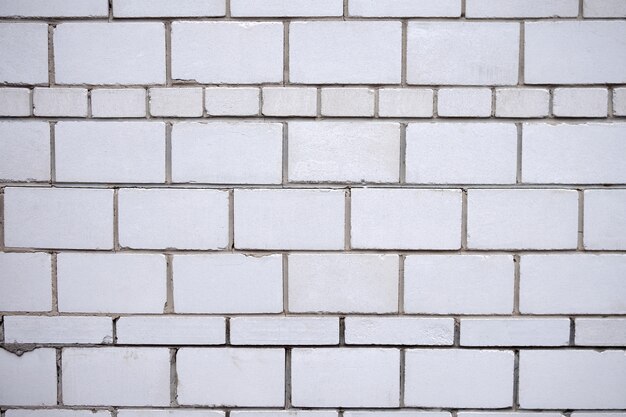 Textura de pared de ladrillo blanco para su texto o diseño.