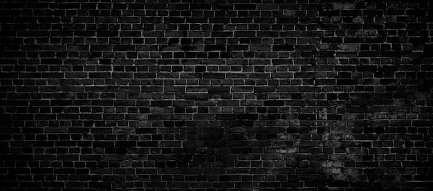 Textura de pared de ladrillo negro abstracto para imagen panorámica amplia de fondo de patrón
