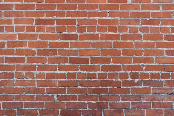 una textura de pared de ladrillo rojo con un ladrillo blanco que dice ladrillo