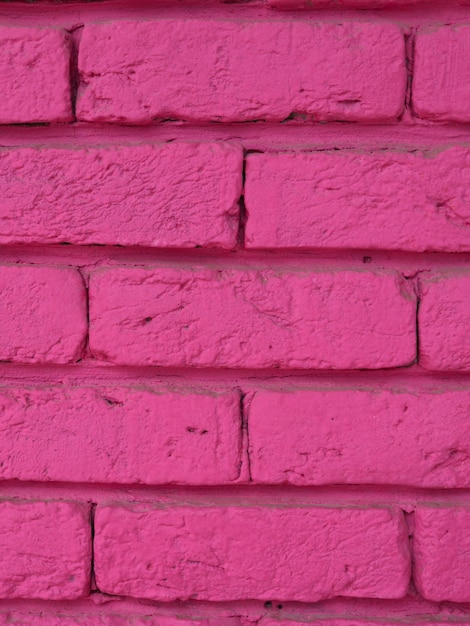 Foto textura de pared de ladrillo rosa