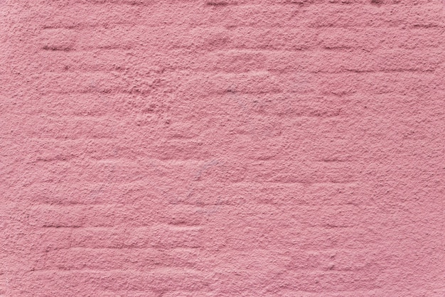 Textura de una pared de ladrillo rosa.