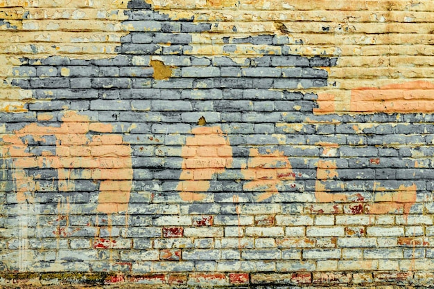 Textura de una pared de ladrillos con grietas y arañazos que se pueden utilizar como fondo