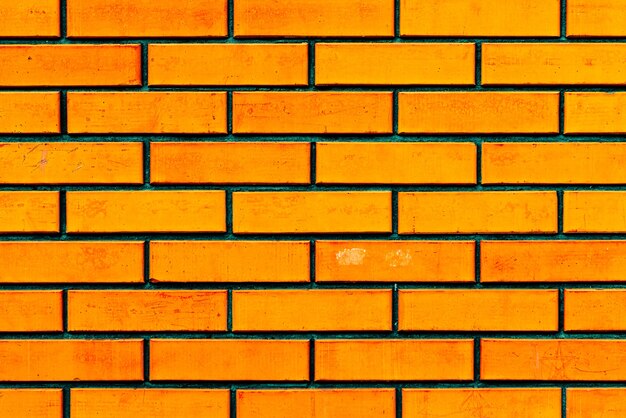 Foto textura de una pared de ladrillos con grietas y arañazos que se pueden utilizar como fondo