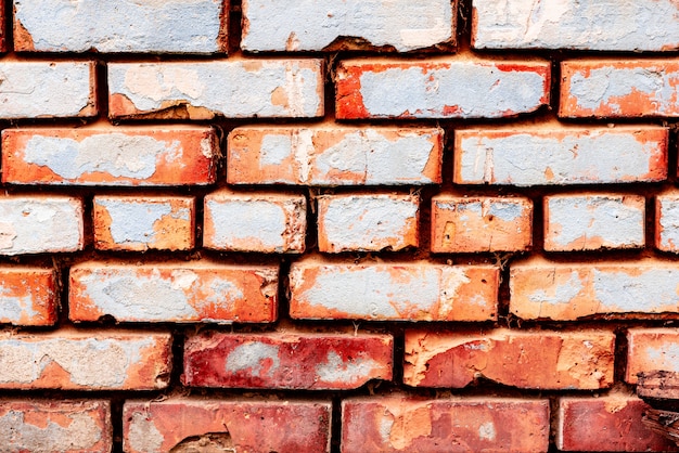 Textura de una pared de ladrillos con grietas y rasguños de fondo