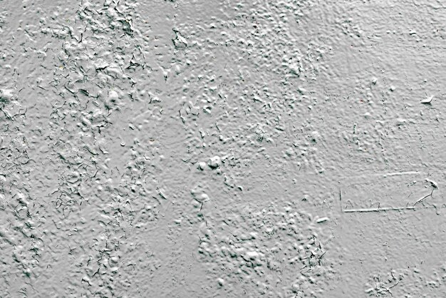 Textura de una pared de metal con grietas y arañazos que se pueden utilizar como fondo